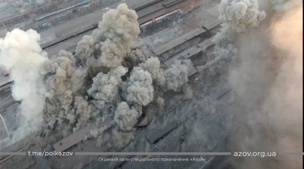 Smoke rises around an industrial compound after multiple explosions amid the Russian invasion of Ukraine, in Mariupol, in this screengrab from a video released Tuesday. Photo: via Reuters