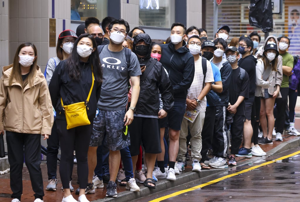 Residents queue up outside a Swatch outlet in Causeway Bay on Saturday. Photo: Dickson Lee