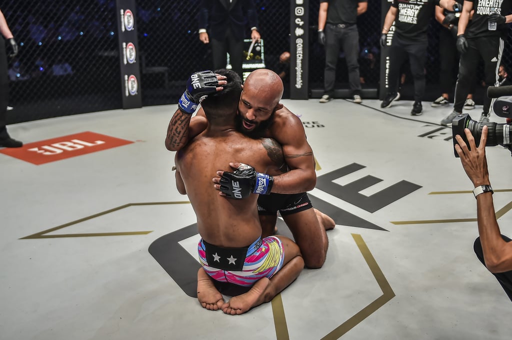 Demetrious Johnson hugs Rodtang after their fight at ONE X.