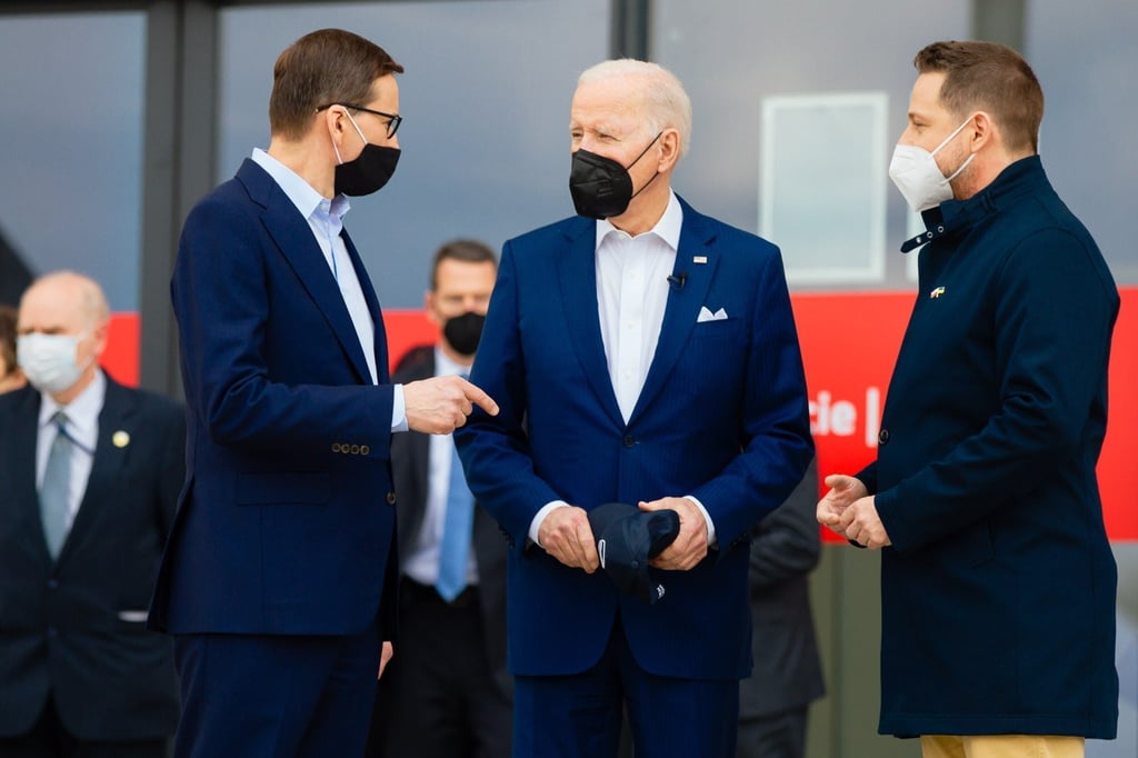 From left, Polish Prime Minister Mateusz Morawiecki, US President Joe Biden and Mayor of Warsaw Rafal Trzaskowski at the National Stadium in Warsaw, Poland, on March 26. Photo: EPA-EFE