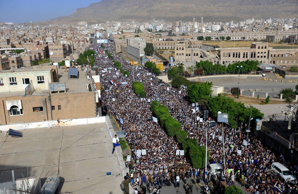 Yemenis loyal to Houthi rebels take part in a rally in Sanaa marking the seventh anniversary of the Saudi-led coalition’s intervention in their country on Saturday. Photo: AFP