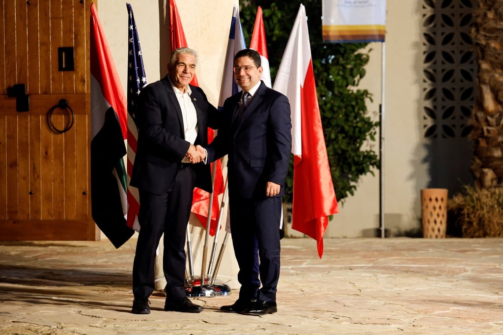 Israel’s Foreign Minister Yair Lapid, left, shakes hands with Morocco’s Foreign Minister Nasser Bourita in Sde Boker, Israel on March 27. Photo: Reuters Israel’s Foreign Minister Yair Lapid, left, shakes hands with Morocco’s Foreign Minister Nasser Bourita in Sde Boker, Israel on March 27. Photo: Reuters