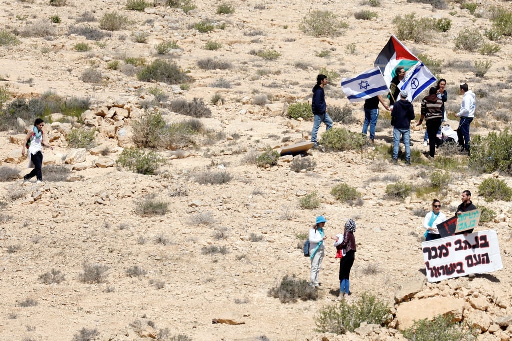 People protest for and against the Negev summit. Photo: Reuters