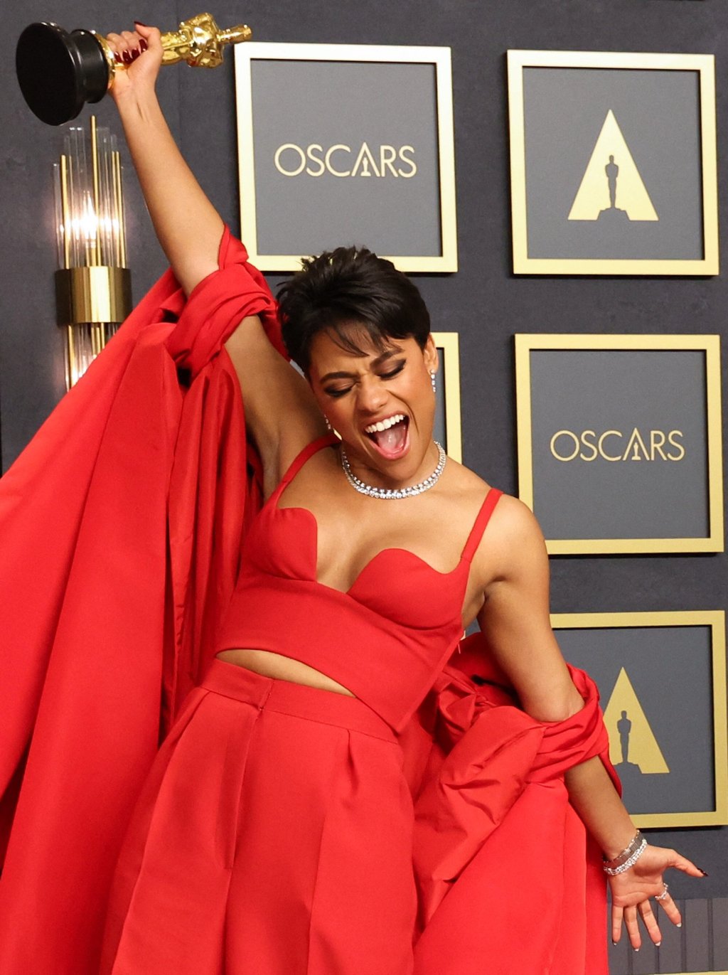 Best supporting actress winner Ariana DeBose poses with her Oscar backstage at the Dolby Theatre. Photo: Reuters
