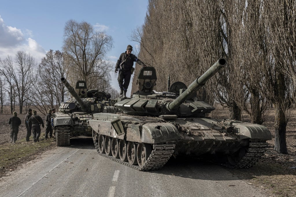 A Ukrainian serviceman stands on top of a Russian tank captured in the village of Lukyanivka outside Kyiv on Sunday. Photo: Reuters A Ukrainian serviceman stands on top of a Russian tank captured in the village of Lukyanivka outside Kyiv on Sunday. Photo: Reuters