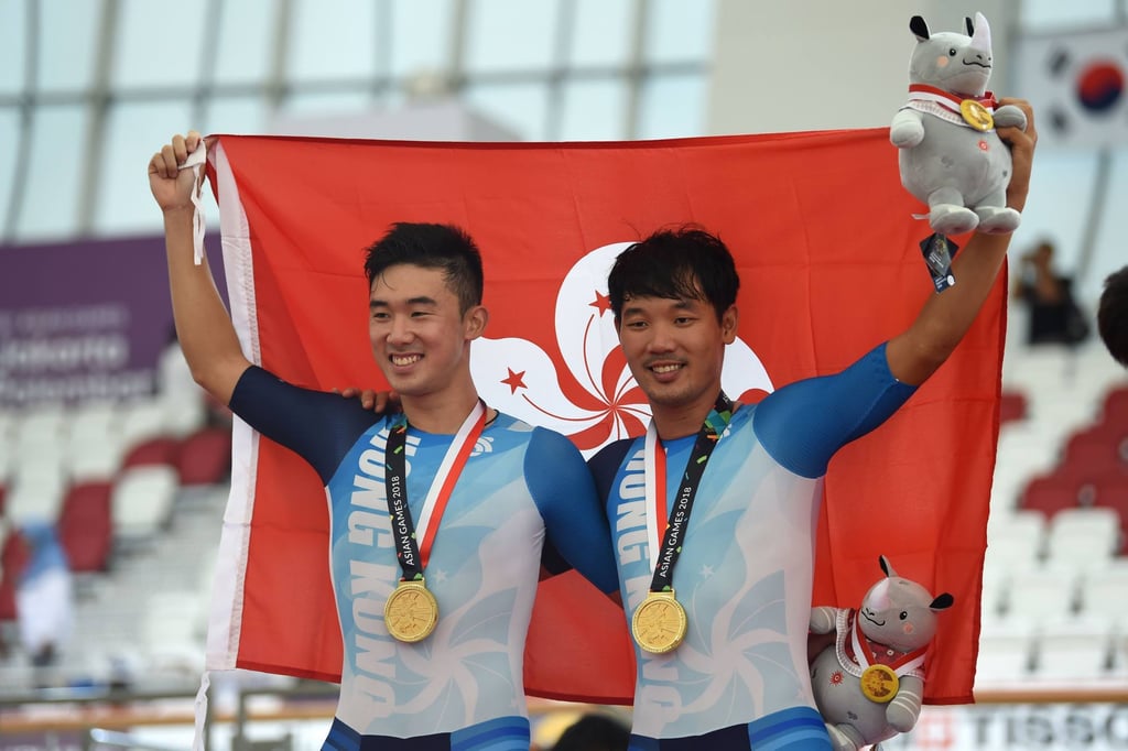 Hong Kong cyclists Leung Chun-wing (left) and Cheung King-lok at the awards ceremony after winning gold in the Madison at the 2018 Asian Games. Photo: AFP