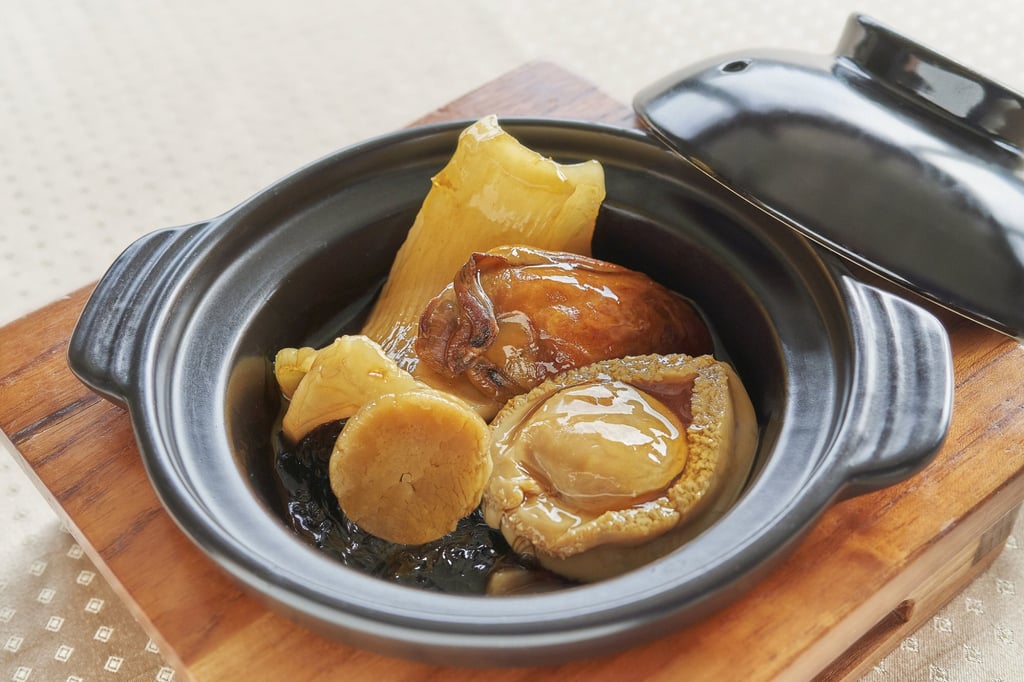 Braised whole abalone, sea cucumber, sun-dried oysters served in a casserole. Photo: Handout Braised whole abalone, sea cucumber, sun-dried oysters served in a casserole. Photo: Handout