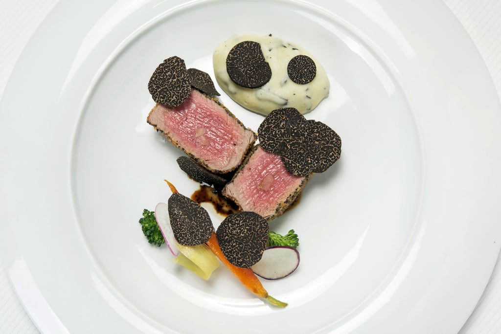 Black truffle Fassone veal tenderloin, black truffle crust, truffle sauce, Parmigiano cheese fondue. Photo: 8 1/2 Otto E Mezzo Bombana Black truffle Fassone veal tenderloin, black truffle crust, truffle sauce, Parmigiano cheese fondue. Photo: 8 1/2 Otto E Mezzo Bombana