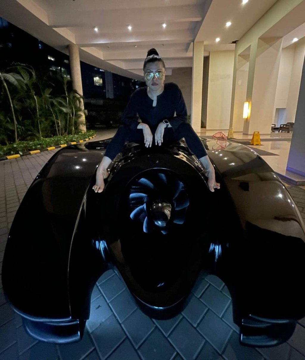 Shaira Khan posing with her Batmobile. Photo: @shairaahmedkhan/Instagram