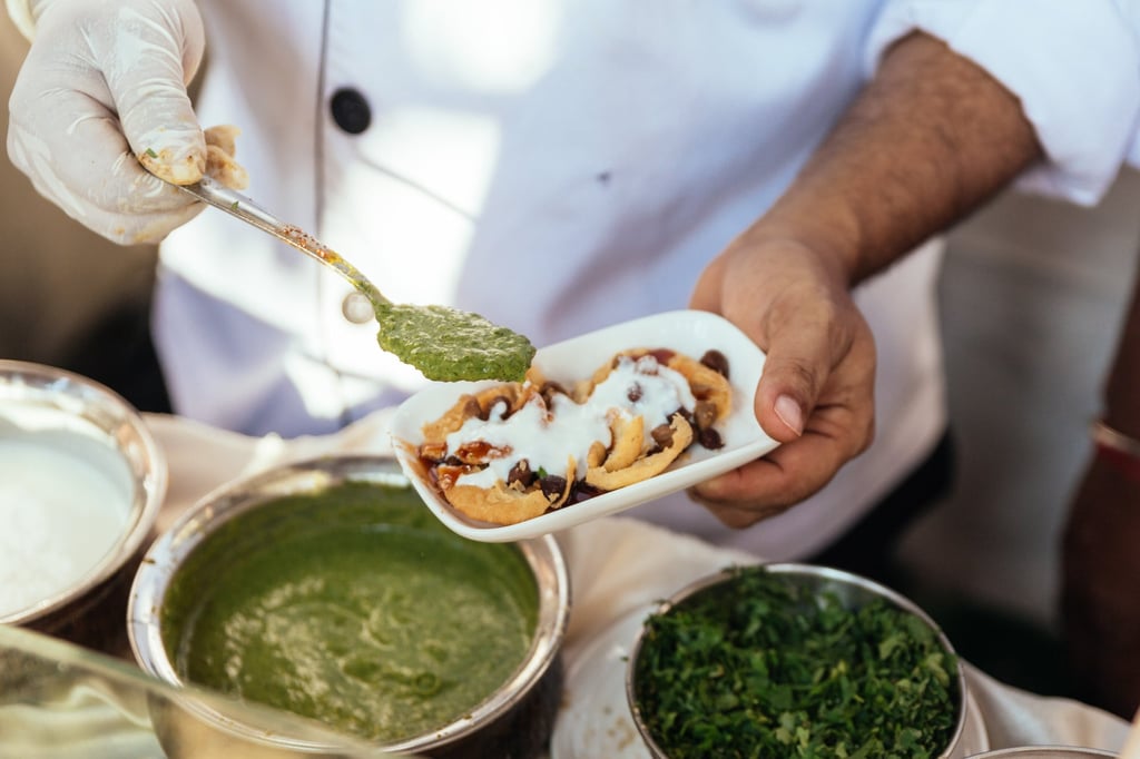 These fried dough wafers are spread with tamarind chutney, an example of the many uses to which the Indian condiments are put. Photo: Getty Images