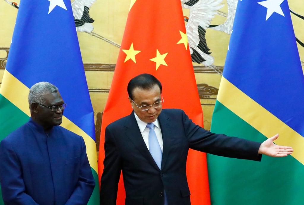 Solomon Islands Prime Minister Manasseh Sogavare, left, and Chinese Premier Li Keqiang at the Great Hall of the People in Beijing on October 9, 2019. Photo: AP