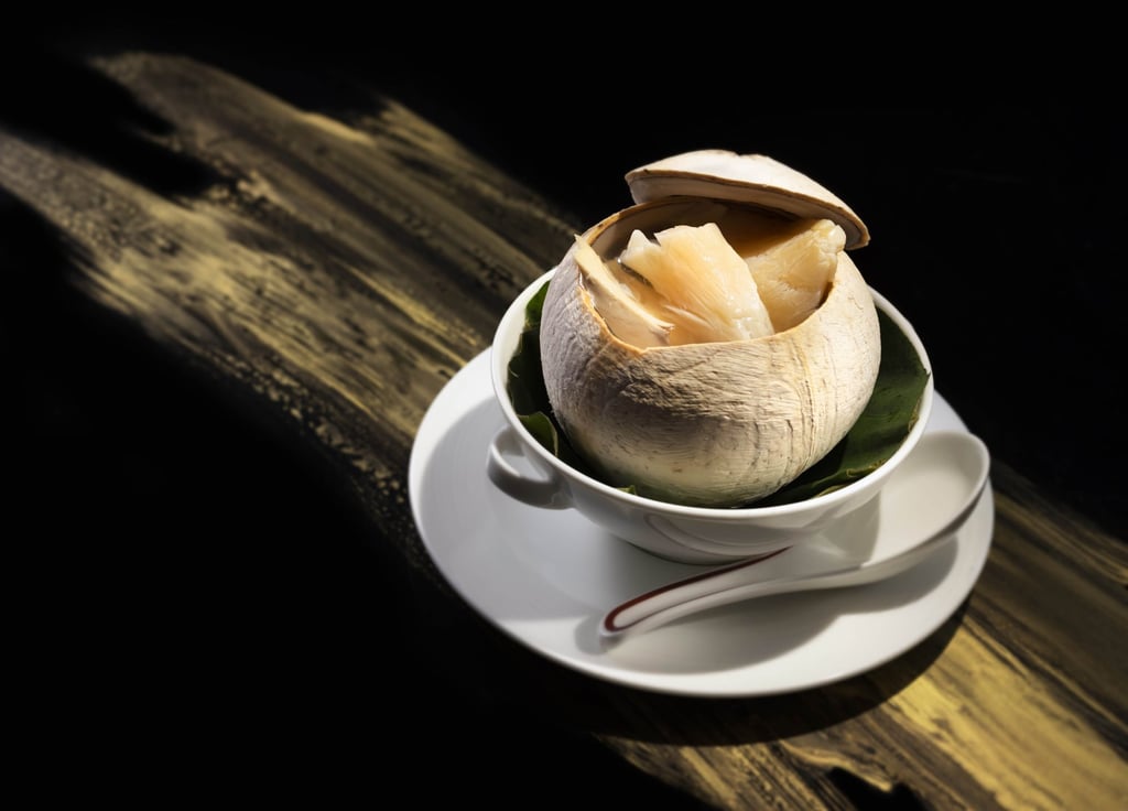 Tin Lung Heen's double-boiled chicken soup with fish maw in baby coconut. Photo: Tin Lung Heen Tin Lung Heen's double-boiled chicken soup with fish maw in baby coconut. Photo: Tin Lung Heen