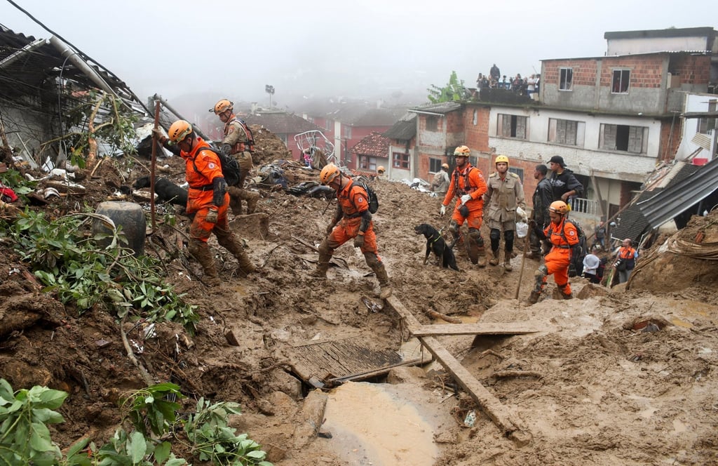 Rescue workers on the site of a mudslide at Morro da Oficina after pouring rains in Petropolis, Brazil. Photo: Reuters