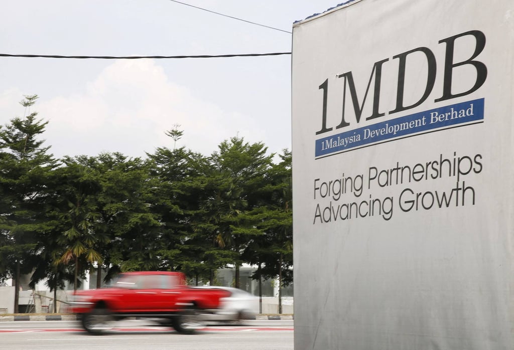 Traffic passes a 1MDB sign in Kuala Lumpur, Malaysia. File photo: Reuters Traffic passes a 1MDB sign in Kuala Lumpur, Malaysia. File photo: Reuters