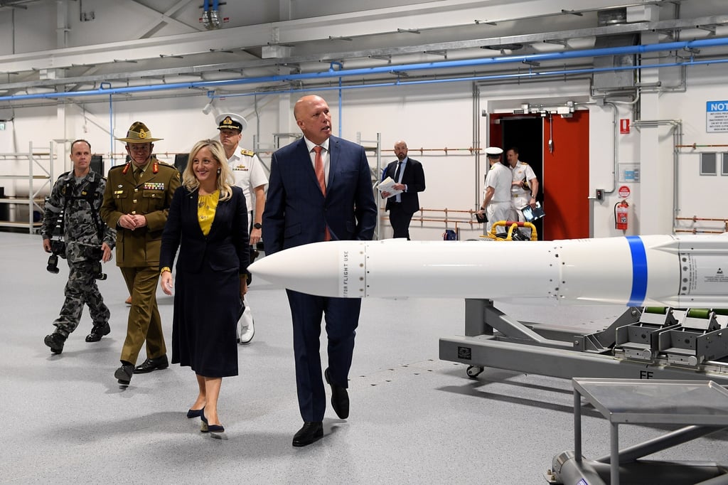 Australian Defence Minister Peter Dutton (centre), along with Federal Member for Lindsay Melissa McIntosh attend the opening of the Navy Guided Weapons Maintenance Facility in Sydney, Australia Photo: EPA-EFE