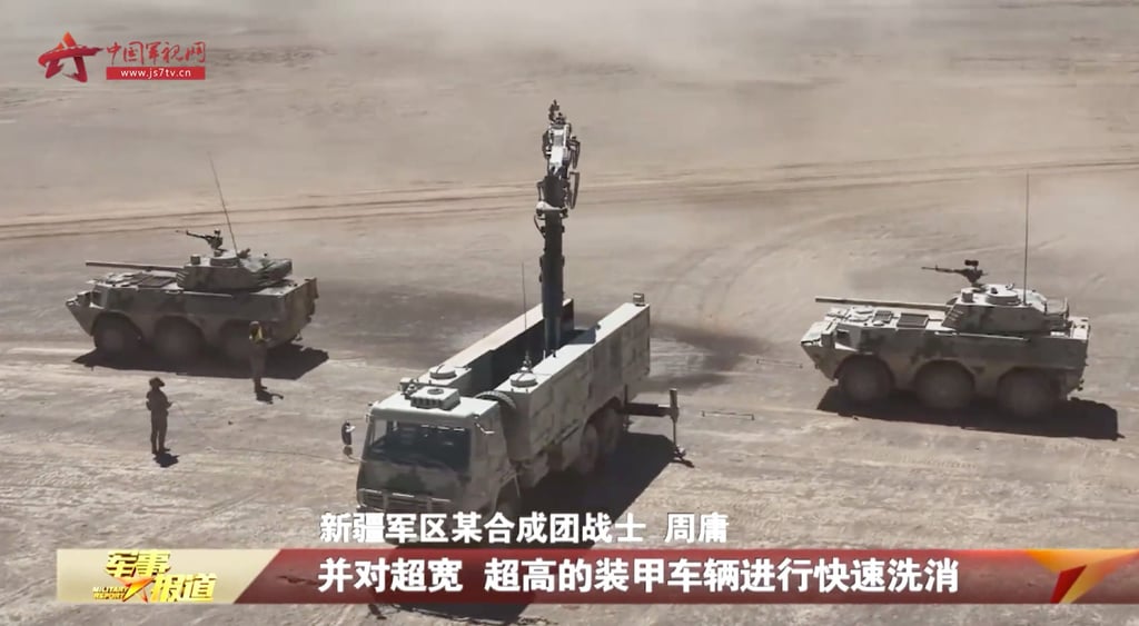 A decontamination vehicle washes and disinfects military vehicles after a simulated “chemical weapon attack” in a joint operation drill by infantry forces of the Xinjiang military district. Photo: CCTV A decontamination vehicle washes and disinfects military vehicles after a simulated “chemical weapon attack” in a joint operation drill by infantry forces of the Xinjiang military district. Photo: CCTV