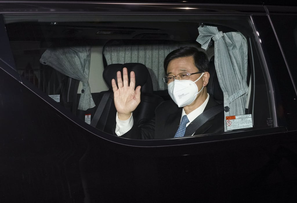 John Lee leaves the Central Government Offices on Wednesday after announcing his intention to run in next month’s chief executive election. Photo: Felix Wong