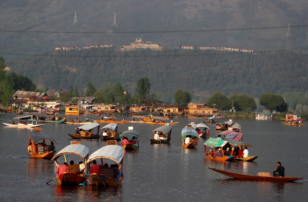 Tourists ride “shikari” boats on Dal Lake in Srinagar, Indian Kashmir. Photo: Reuters