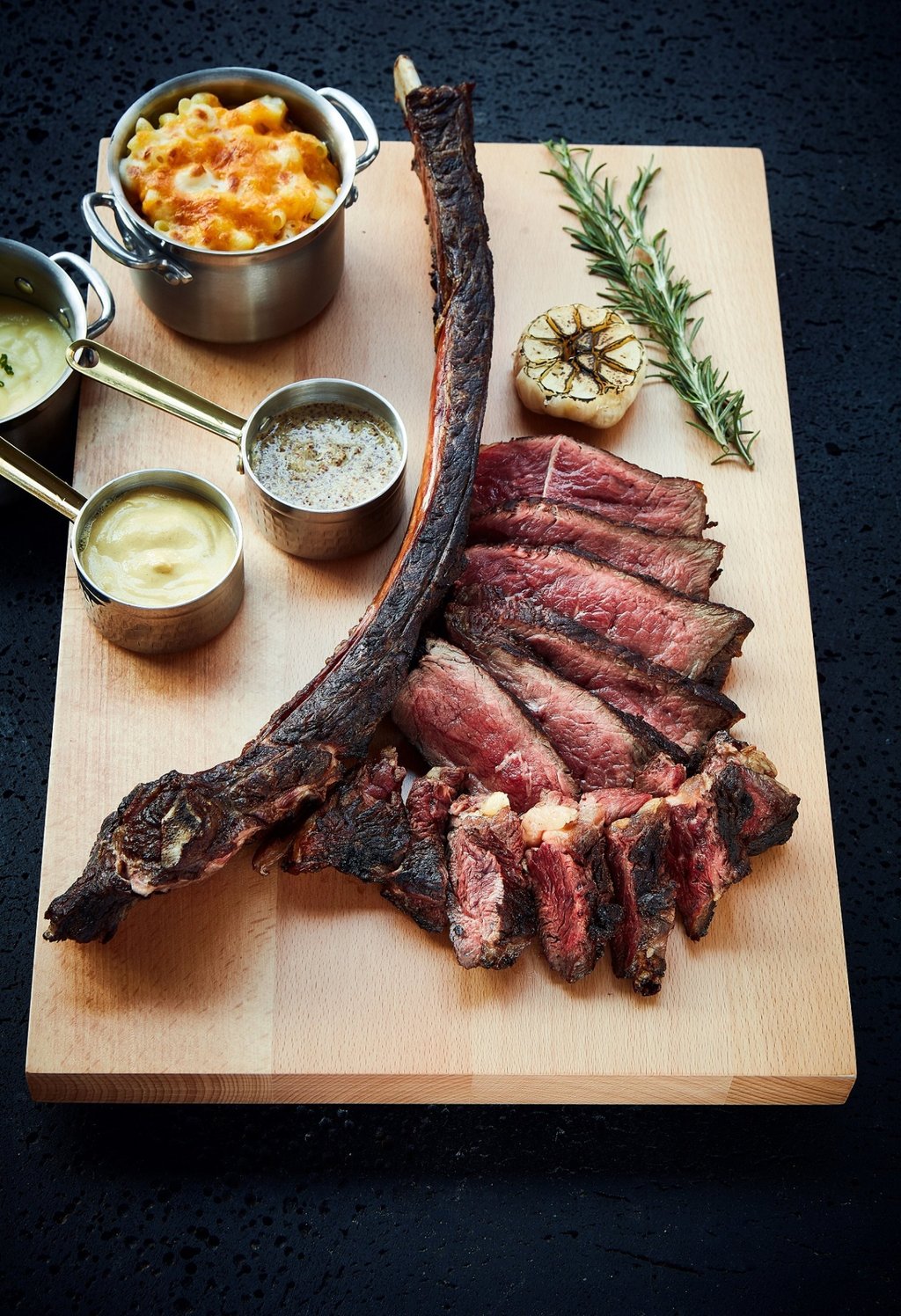 Dry-aged USDA prime bone-in rib eye, seasoned for 28 days with bourbon and oolong tea, at Prohibition Grill House & Cocktail Bar. Photo: Handout