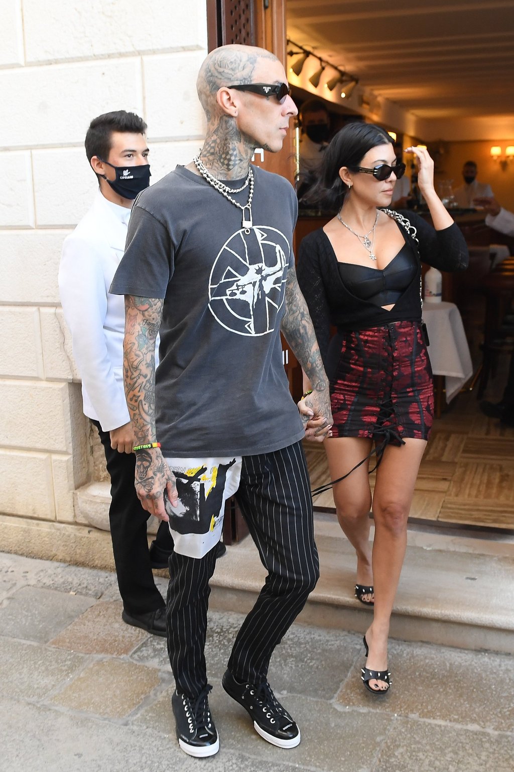 Kourtney Kardashian and Travis Barker s 9 best couple looks from their daring Grammys and identical secret wedding fashion to vintage Dolce Gabbana at the Oscars South China Morning Post