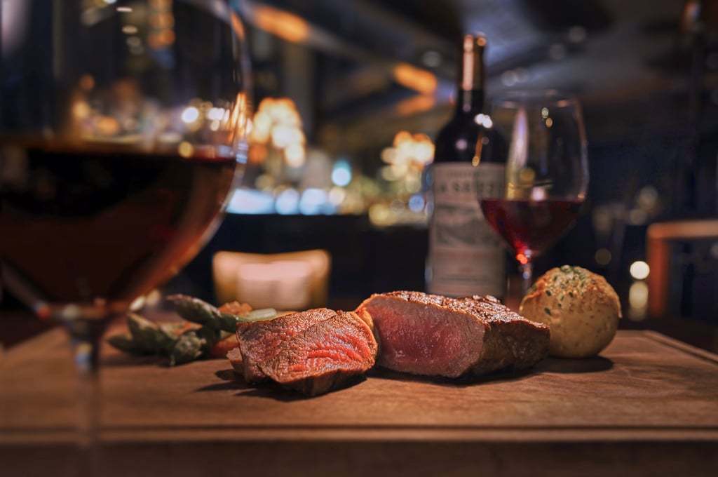 A classic rib-eye and wine at the Grand Hyatt Steakhouse. Photo: Handout