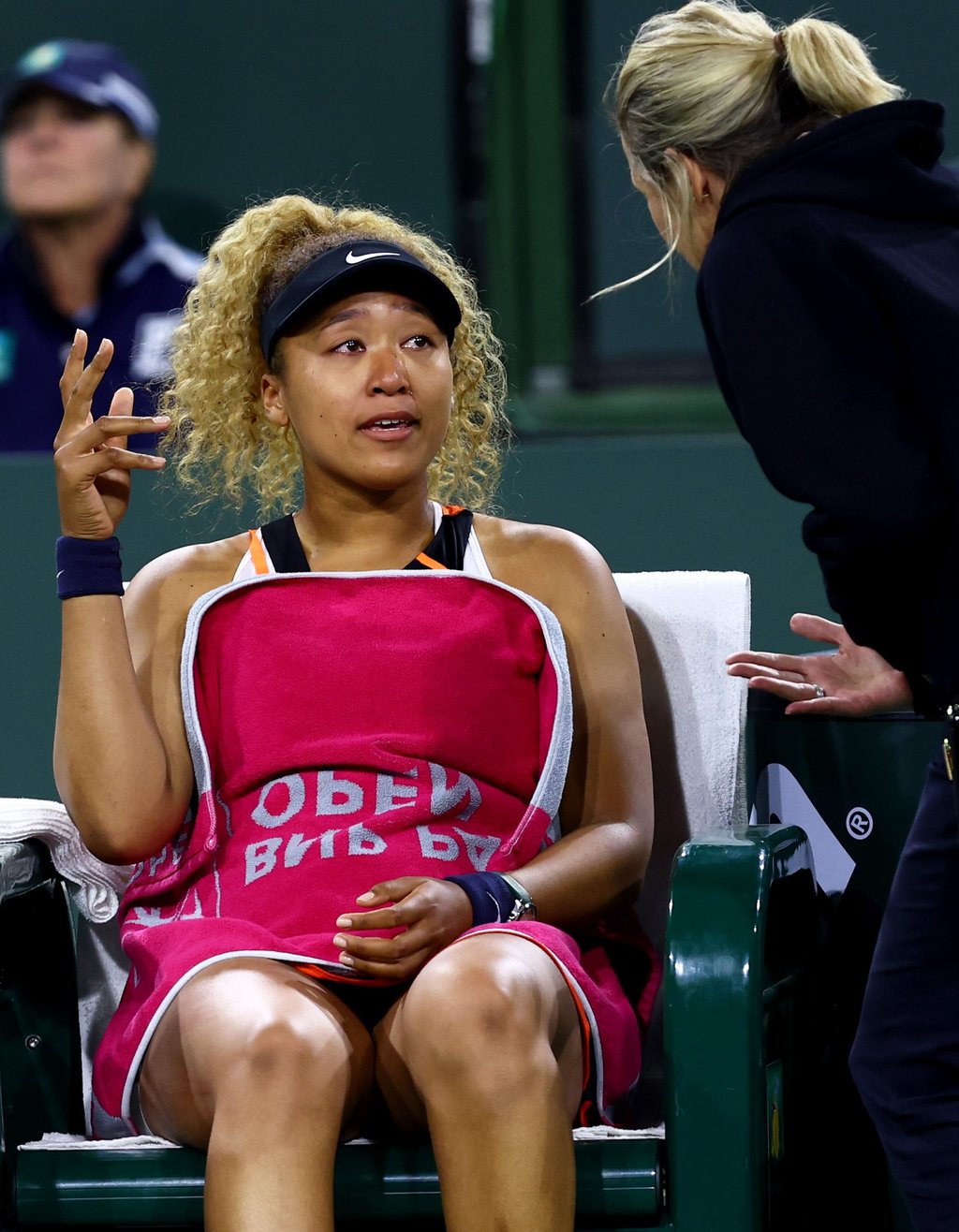 Naomi Osaka speaks with WTA supervisor Clare Wood after play was disrupted by a shout from the crowd during her straight sets defeat against Veronika Kudermetova. Photo: AFP Naomi Osaka speaks with WTA supervisor Clare Wood after play was disrupted by a shout from the crowd during her straight sets defeat against Veronika Kudermetova. Photo: AFP