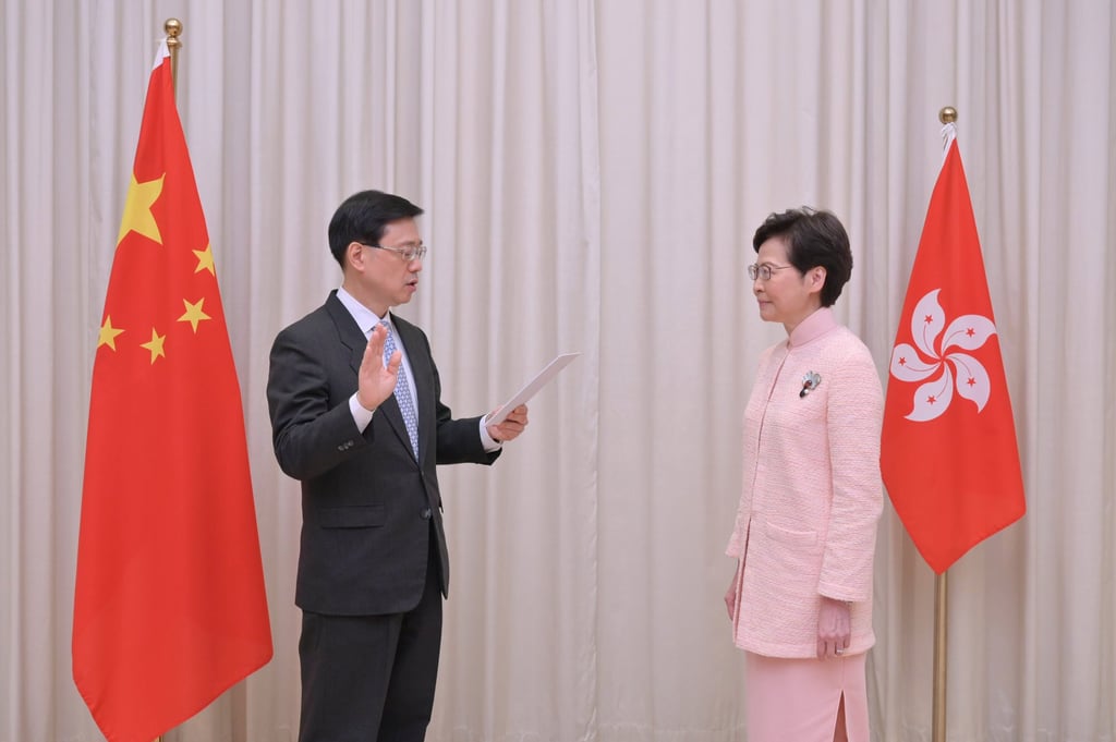 Carrie Lam witnesses John Lee’s swearing-in as chief secretary last year. Photo: Handout Carrie Lam witnesses John Lee’s swearing-in as chief secretary last year. Photo: Handout
