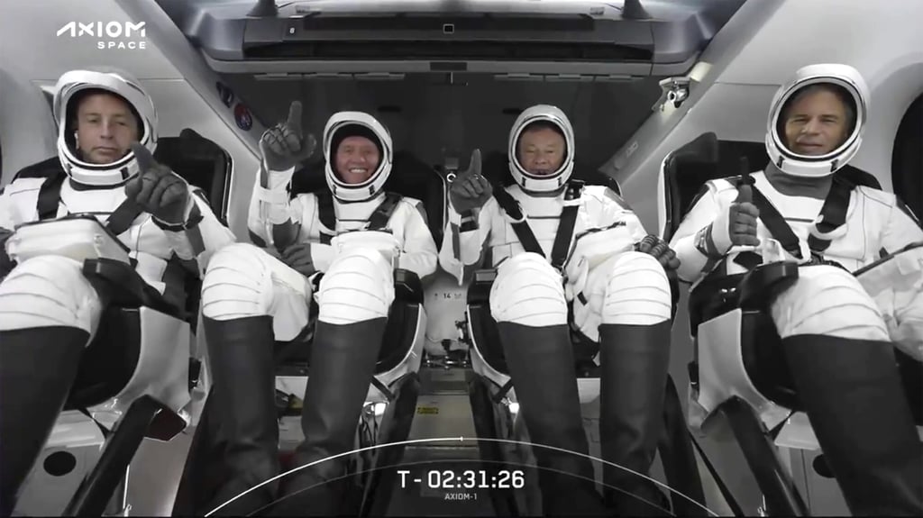 The SpaceX crew seated in the Dragon spacecraft in Cape Canaveral, Florida. Photo: AP The SpaceX crew seated in the Dragon spacecraft in Cape Canaveral, Florida. Photo: AP