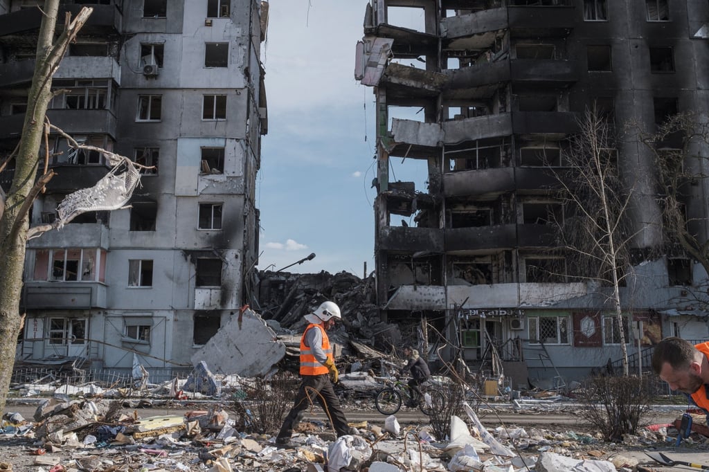 A clean up worker walks past buildings that were destroyed by shelling, amid Russia’s invasion of Ukraine in Borodyanka, in the Kyiv region on Thursday. Photo: Reuters A clean up worker walks past buildings that were destroyed by shelling, amid Russia’s invasion of Ukraine in Borodyanka, in the Kyiv region on Thursday. Photo: Reuters