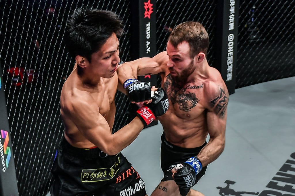 Jarred Brooks throws an elbow at Hiroba Minowa. Photo: ONE Championship.