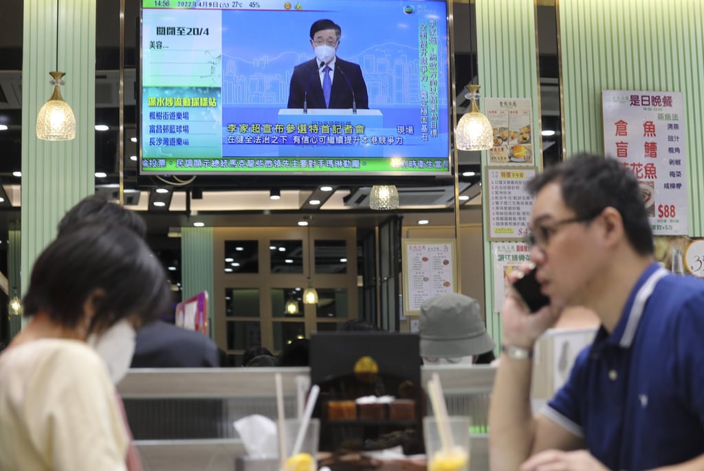 John Lee’s press conference plays on a television at a restaurant in Causeway Bay. Photo: Xiaomei Chen