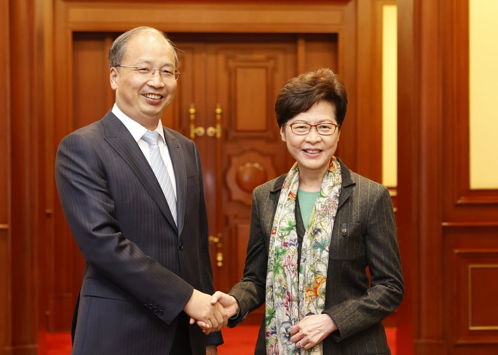 Hong Kong’s Chief Executive Carrie Lam Cheng Yuet-ngor (right) and the chairman of the China Securities Regulatory Commission (CSRC) Yi Huiman (left) during a meeting in Beijing on November 5, 2020. Photo: Handout. Hong Kong’s Chief Executive Carrie Lam Cheng Yuet-ngor (right) and the chairman of the China Securities Regulatory Commission (CSRC) Yi Huiman (left) during a meeting in Beijing on November 5, 2020. Photo: Handout.