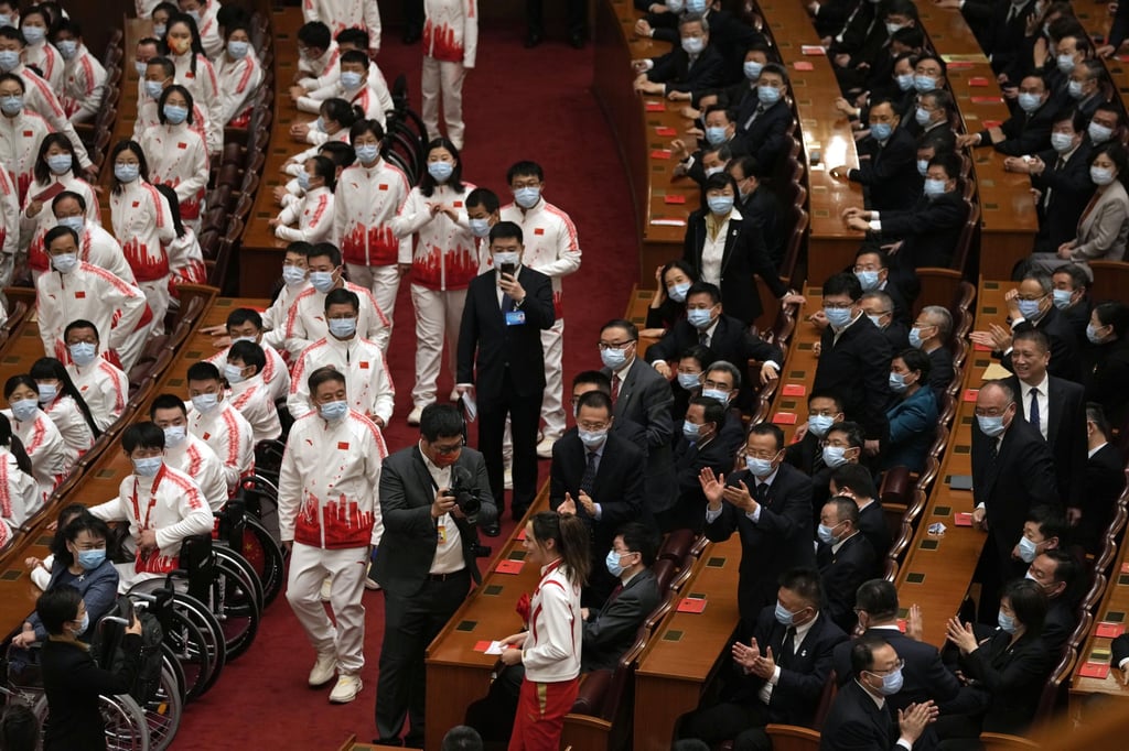 Attendees applaud as Olympic gold medallist Eileen Gu arrives at the Great Hall of the People for a ceremony to celebrate the Beijing Winter Olympics and Paralympics. Photo: AP Attendees applaud as Olympic gold medallist Eileen Gu arrives at the Great Hall of the People for a ceremony to celebrate the Beijing Winter Olympics and Paralympics. Photo: AP