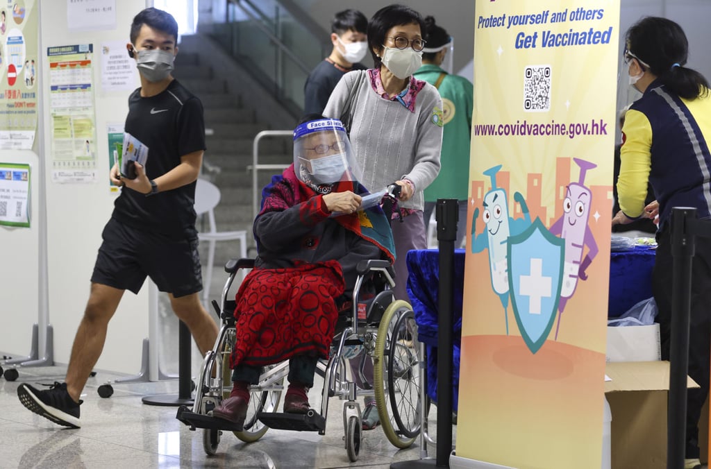 An elderly person is helped at a community vaccination centre in Tsing Yi. Photo: May Tse