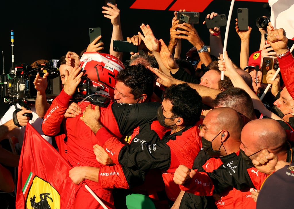 Ferrari’s Charles Leclerc celebrates with his team. Photo: Reuters/Martin Keep