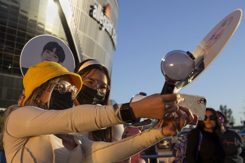 BTS fans take selfies in front of Allegiant Stadium in Las Vegas on April 8. Photo: Ellen Schmidt/Las Vegas Review-Journal via AP