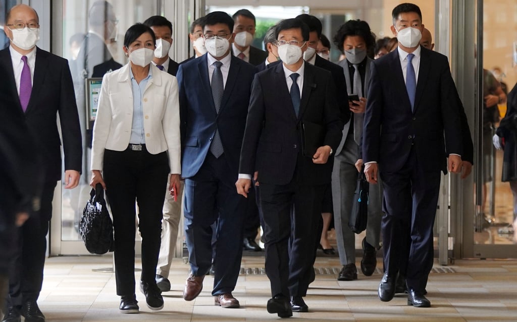 Chief executive hopeful John Lee (centre) visits the Hong Kong Chinese Enterprises Association in Wan Chai on Tuesday morning. Photo: Sam Tsang Chief executive hopeful John Lee (centre) visits the Hong Kong Chinese Enterprises Association in Wan Chai on Tuesday morning. Photo: Sam Tsang