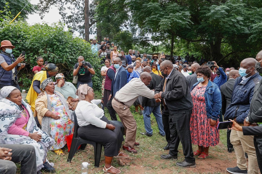 South African President Cyril Ramaphosa (centre right) greets a family member at the United Methodist Church of South Africa in Claremont, near Durban, on Wednesday. Heavy rains and floods have led to the deaths of at least 259 people. Photo: Agence France-Presse