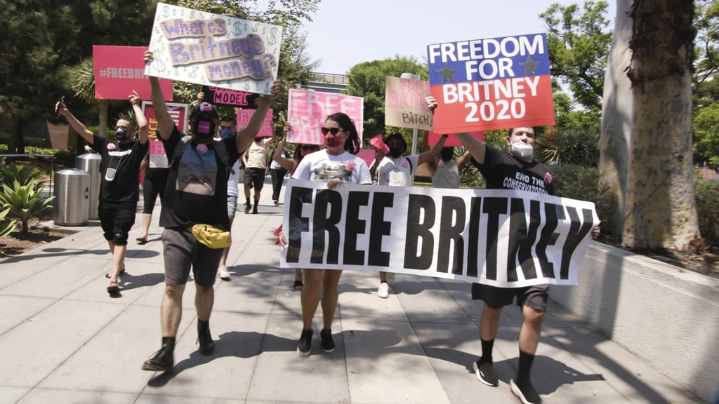 #FreeBritney activists hold signs and march near the Stanley Mosk courthouse, where a conservatorship hearing for Britney Spears is being held, in this image from Framing Britney Spears. Photo: TNS #FreeBritney activists hold signs and march near the Stanley Mosk courthouse, where a conservatorship hearing for Britney Spears is being held, in this image from Framing Britney Spears. Photo: TNS