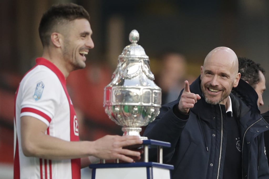 Ajax’s head coach Erik ten Hag gestures as captain Dusan Tadic is about to lift the trophy after winning the 2021 KNVB Cup final against Vitesse. Photo: AP/Peter Dejong Ajax’s head coach Erik ten Hag gestures as captain Dusan Tadic is about to lift the trophy after winning the 2021 KNVB Cup final against Vitesse. Photo: AP/Peter Dejong