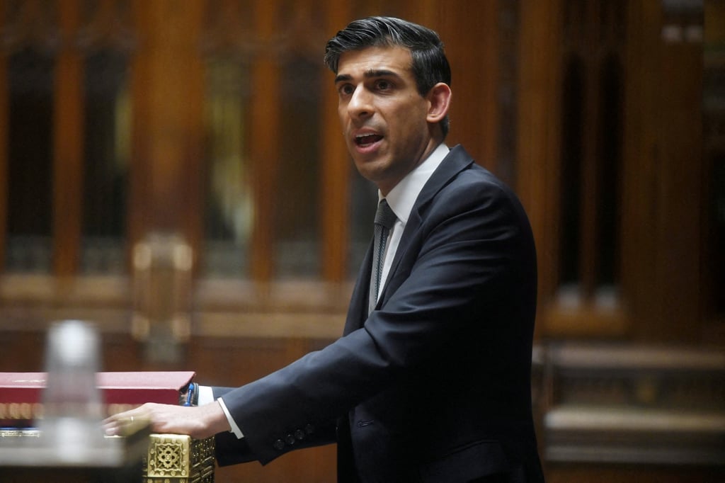 British Chancellor of the Exchequer Rishi Sunak speaks at the House of Commons in London on March 23. Sunak, who had been seen as the favourite to become prime minister after Johnson steps down, is embroiled in a growing scandal over his family’s finances. Photo: Handout via Reuters British Chancellor of the Exchequer Rishi Sunak speaks at the House of Commons in London on March 23. Sunak, who had been seen as the favourite to become prime minister after Johnson steps down, is embroiled in a growing scandal over his family’s finances. Photo: Handout via Reuters