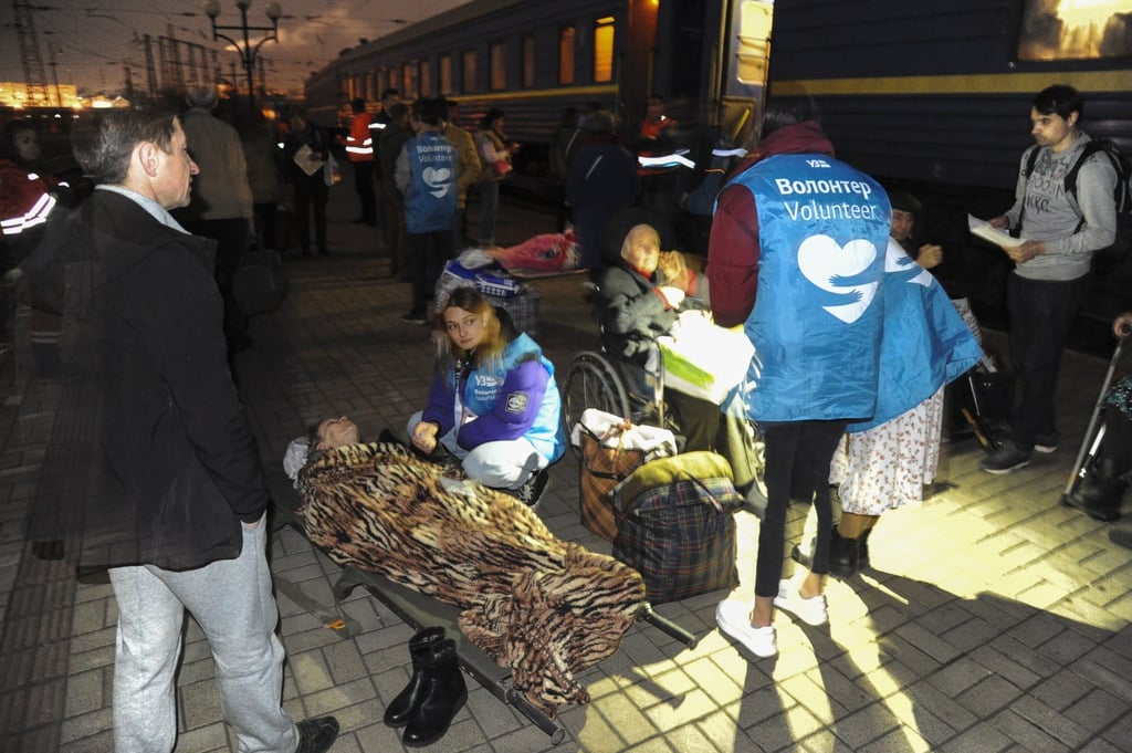 Volunteers assist disabled and elderly refugees in Lviv, Ukraine, on Thursday. Photo: EPA-EFE