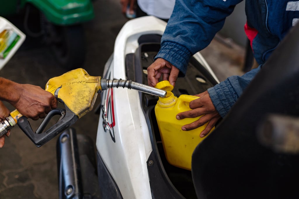A worker fills up a fuel container at a gas station in Colombo, Sri Lanka, on Friday. Photo: Bloomberg A worker fills up a fuel container at a gas station in Colombo, Sri Lanka, on Friday. Photo: Bloomberg