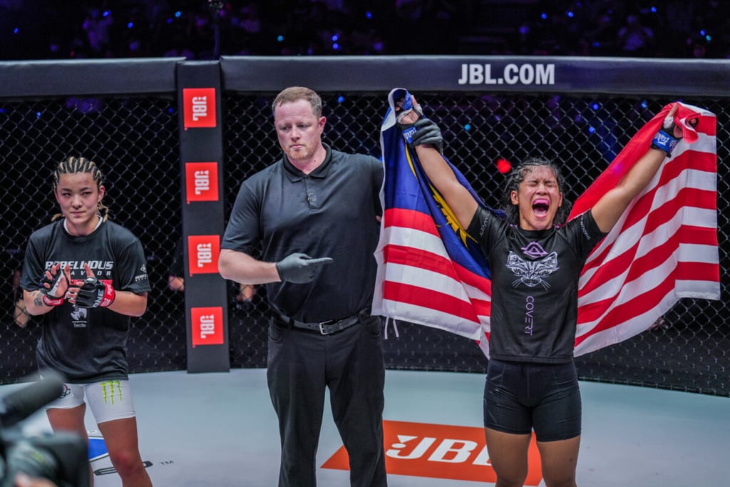 Malaysian atomweight Jihin Radzuan celebrates an upset victory over Japan’s Itsuki Hirata at ONE X on March 26 in Singapore. Photo: ONE Championship. Malaysian atomweight Jihin Radzuan celebrates an upset victory over Japan’s Itsuki Hirata at ONE X on March 26 in Singapore. Photo: ONE Championship.