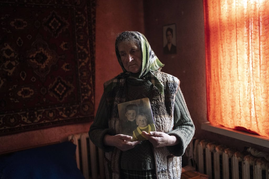 Nadiya Trubchaninova, 70, holding a portrait of her sons Oleg and Vadym. Vadym, 48, was among those killed by Russian soldiers in Bucha, near Kyiv. Photo: AP Nadiya Trubchaninova, 70, holding a portrait of her sons Oleg and Vadym. Vadym, 48, was among those killed by Russian soldiers in Bucha, near Kyiv. Photo: AP