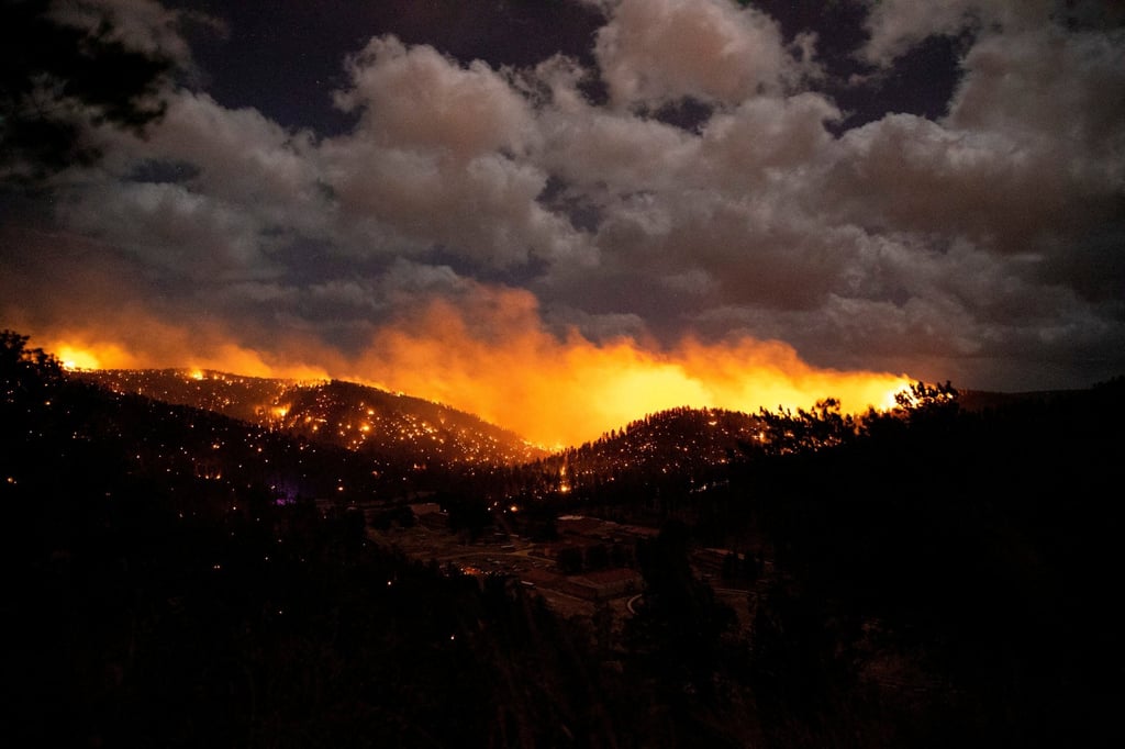 A fire burns in the heart of the village in Ruidoso, New Mexico. Photo: Reuters A fire burns in the heart of the village in Ruidoso, New Mexico. Photo: Reuters