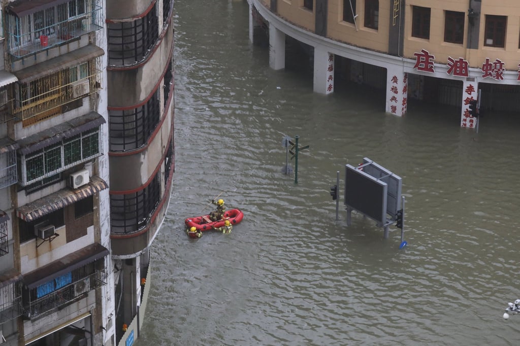 Firefighters on a rescue mission on Avenida de Almeida Ribeiro just as Typhoon Mangkhut made landfall in Macau on 16 September 2018. Photo: Dickson Lee