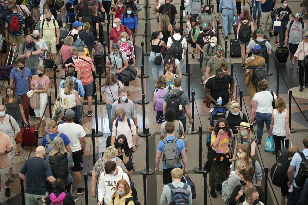 Travellers queuing at Denver International Airport. File photo: AP