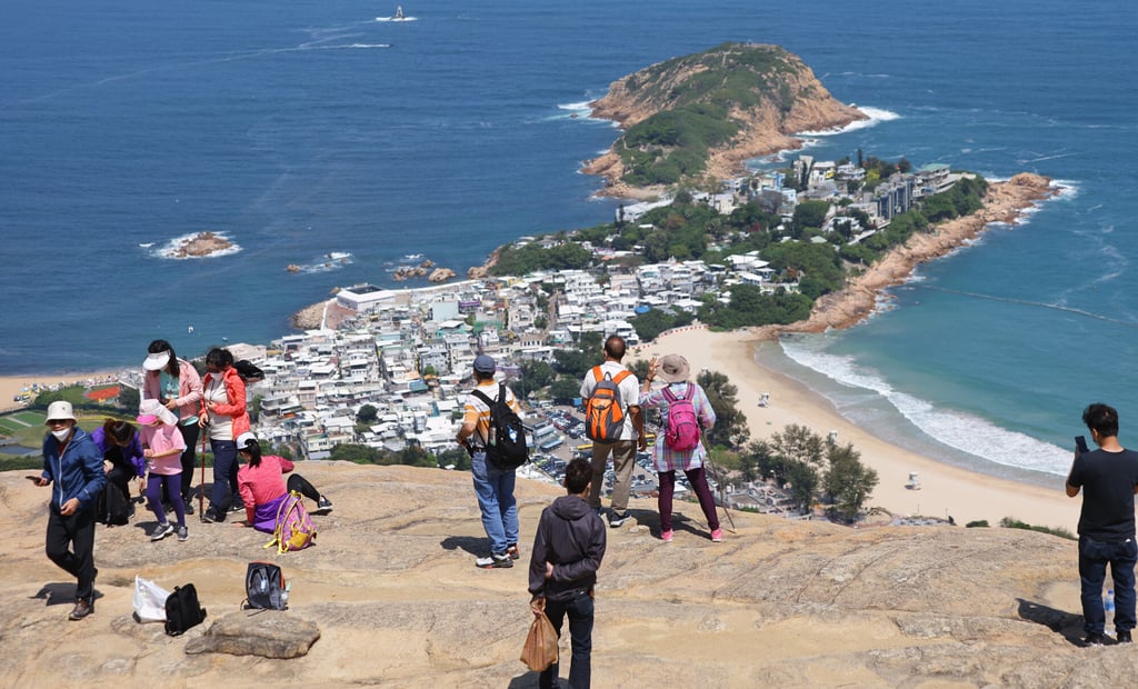 Hikers enjoy the sunny weather on the Dragon’s Back trail near Shek O. Photo Dickson Lee