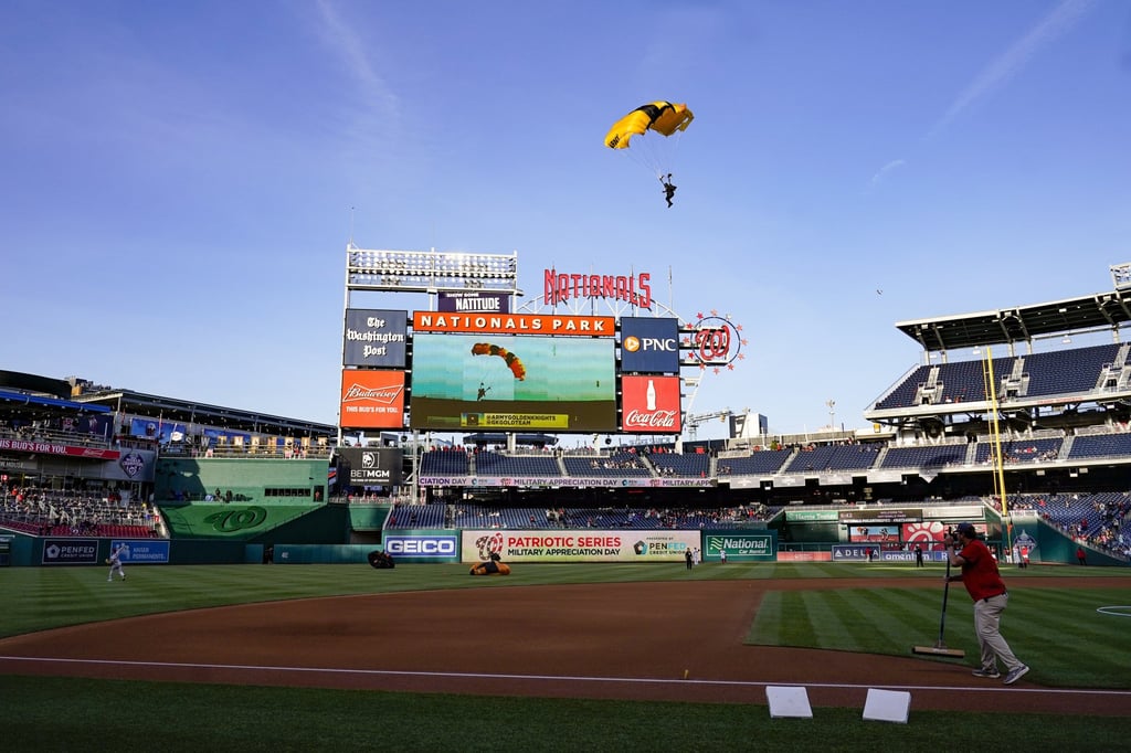 The US Army Parachute Team the Golden Knights descend into National Park before a baseball game between the Washington Nationals and the Arizona Diamondbacks. Photo: AP